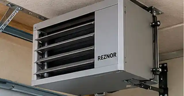 Garage unit heater mounted near the ceiling in a residential garage